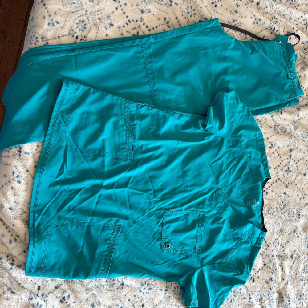 Cherokee Infiniti teal scrubs for men. Top and pants included in the sale.